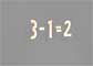 Plywood numbers on a black background in a sum: three minus one equals two.